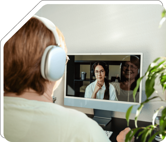 Senior woman video conferencing with advisor.